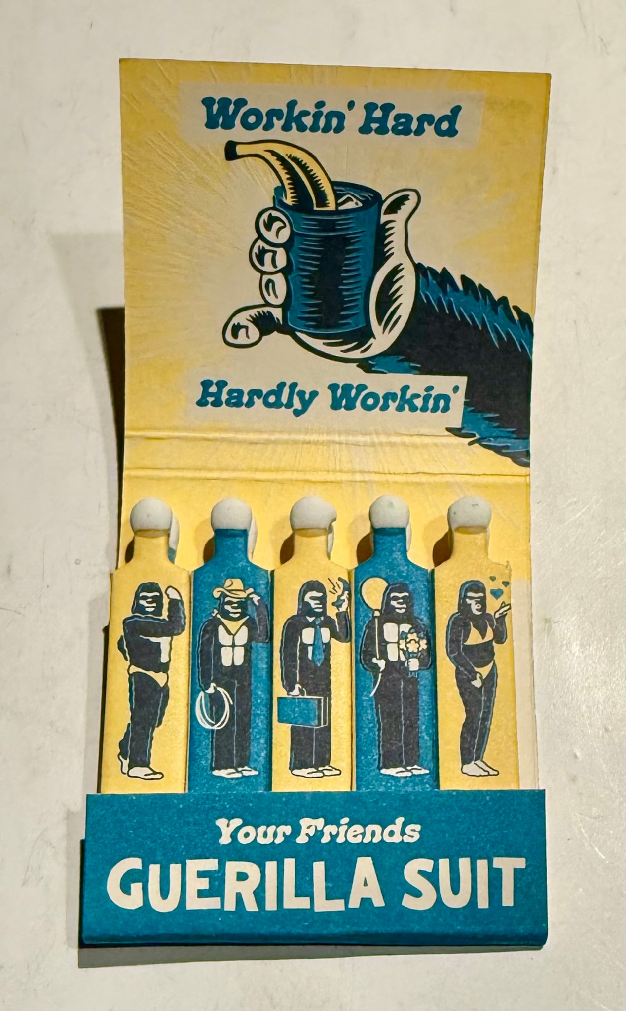 “Guerilla Suit” Retro Feature Matchbook